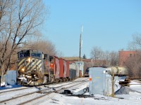 <b>Those double ditchlights.</b> One thing about BCOL locomotives that I've always loved is their double set of ditchlights, and both are turned on as BCOL 4648 leads CN 527 around a curve in the St-Henri neighbourhood of Montreal, with CN 4809 trailing.
