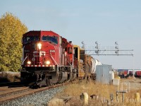 CP 9145 West pulls ahead while the conductor makes his cut on his head end chunk of cars. They will pull west over the crossovers, and get a light to return east and begin their work in the Shepard intermodal terminal, in the east end of Calgary.