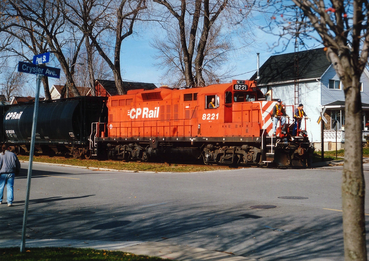 CP only had about 6 weeks left operating in downtown Niagara Falls when this photo was taken. The mainline was then pulled up for a casino and the CP reverted to crossing into the USA at Fort Erie's International Bridge. The connecting track between the CP and the CN yard that ran along Park St was a favourite location of mine. However, it was hit and miss to catch any activity on it. This day, I got lucky. Here is CP 8221 returning to Montrose from the CN, as indicated by the sign, crossing Crysler at Park St. The 8221 was retired in 2013.