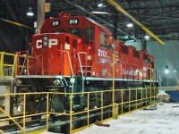 During a January storm Genset 2101 is partially sheltered from the whipping wind and snow under the carport that used to be fully enclosed and was once part of the Car Repair Department.