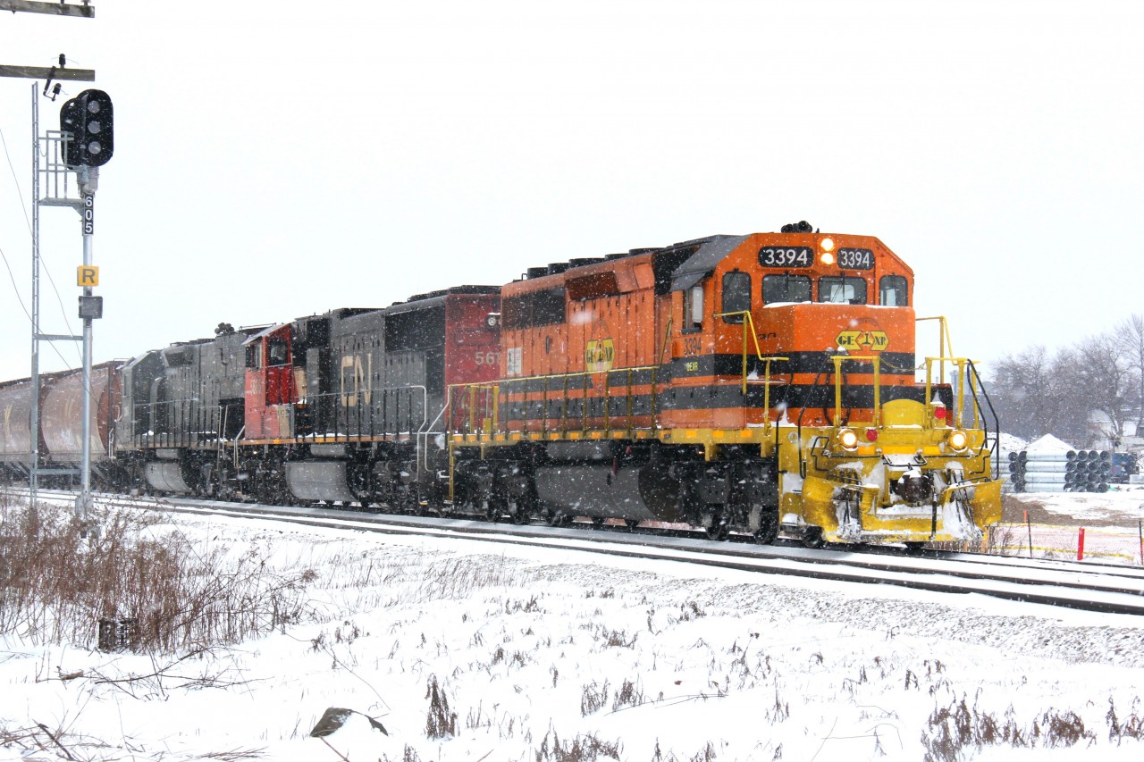 GEXR 432 begins to depart Kitchener for Toronto as flurries linger on this cold January morning. Power is GEXR 3394-CN 5686-GEXR 3054.
