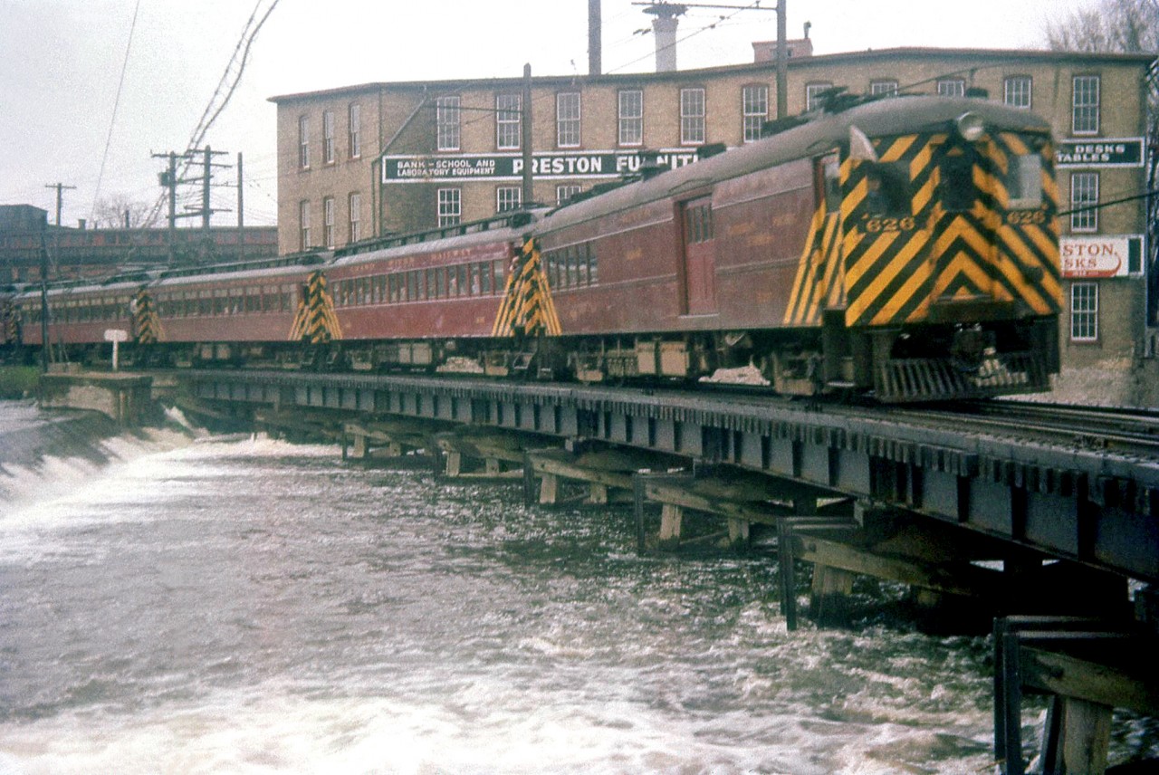 Grand River Railway interurban electric car 626 (combination passenger and baggage-express car) leads a NRHS fantrip run that was to be the one of the last runs of "streetcars" on GRR & LE&N, on April 24th 1955. The train is shown here crossing the Speed River bridge at Preston, approaching the GRR shops.

According to the late W.E. Miller's Grand River Railway website, the full consist for the day was GRR 626, 846, LE&N 939 & 937, with GRR 862 added at Brantford. Regular passenger service had ended the day before on April 23rd. This day was the NRHA Syracuse Chapter's fantrip, the Buffalo Chapter held theirs a week later on May 1st.