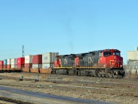 A pair of Dash 9-44CW, cn 2567 and 2539 head east past Clover Bar Yard.