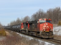 CN 2331 leads CN 2032 down the Halton sub. past MM30 and about to cross side road 10 on its way in to Milton with a mixed load a freight and a brand new GO Metrolinx engine #312 at the tail end. 