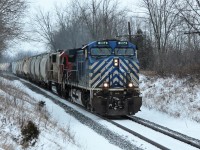 CEFX 1014 leads a still red and white SOO 6037 around the bend and down the grade up to MM43 on the Galt sub.