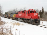 Ex SOO and now CP 6238 along with CSX 512 and CSX 56 exit Guelph Junction and power up to head down the Hamilton sub as they are  about to cross side road #3 and MM 75.11.