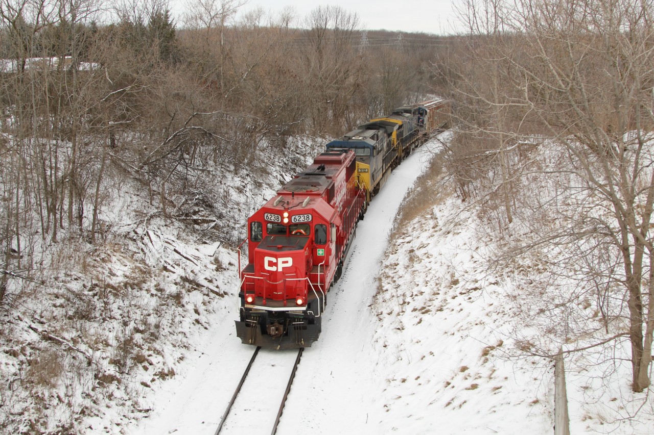 EX-SOO and now CP 6238 leads CFX 512 and CFX 56 down the Hamilton Sub. and are about to go under the Snake road overpass.