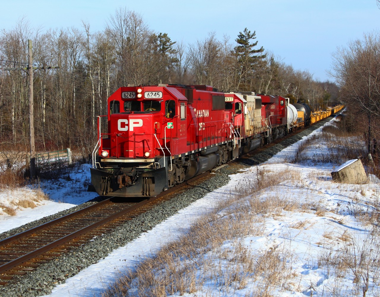 After coming up the Hamilton sub, Ex SOO CP 6245 leads SOO 6037 and CP 8835 up the grade and past MM43 on the Galt sub. Its always nice to see a SOO in its original colour scheme and have the sun shine.