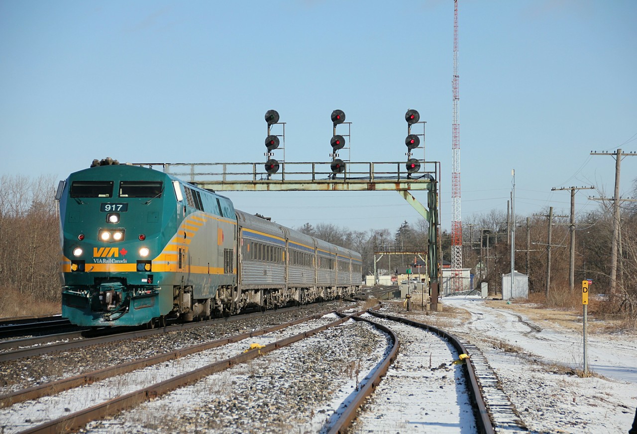 VIA 73 slows to a stop at Paris, to wait for CN Q148 at Paris West.