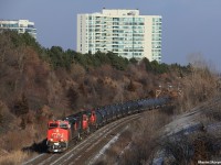 A fresh looking ES44AC leads train M305 past Hilda Ave, with a fair variety in the consist, having an SD75I, an SD70M-2, and a ET44AC (Tier 4) as mid DPU. 