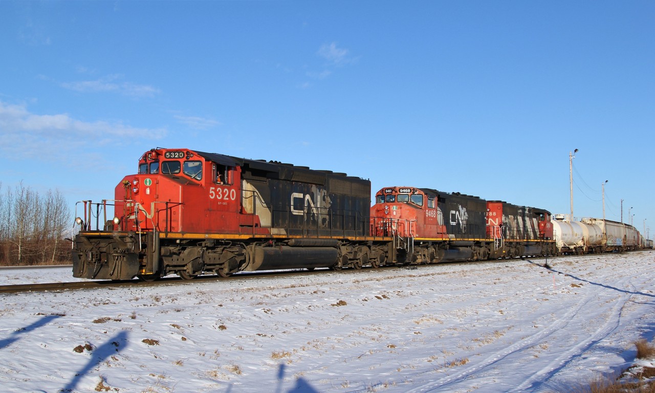 SD40-2(W) 5320, GP40-2L(W) 9468 and SD40-2(W) 5286 depart from Scotford Yard with CN 511.