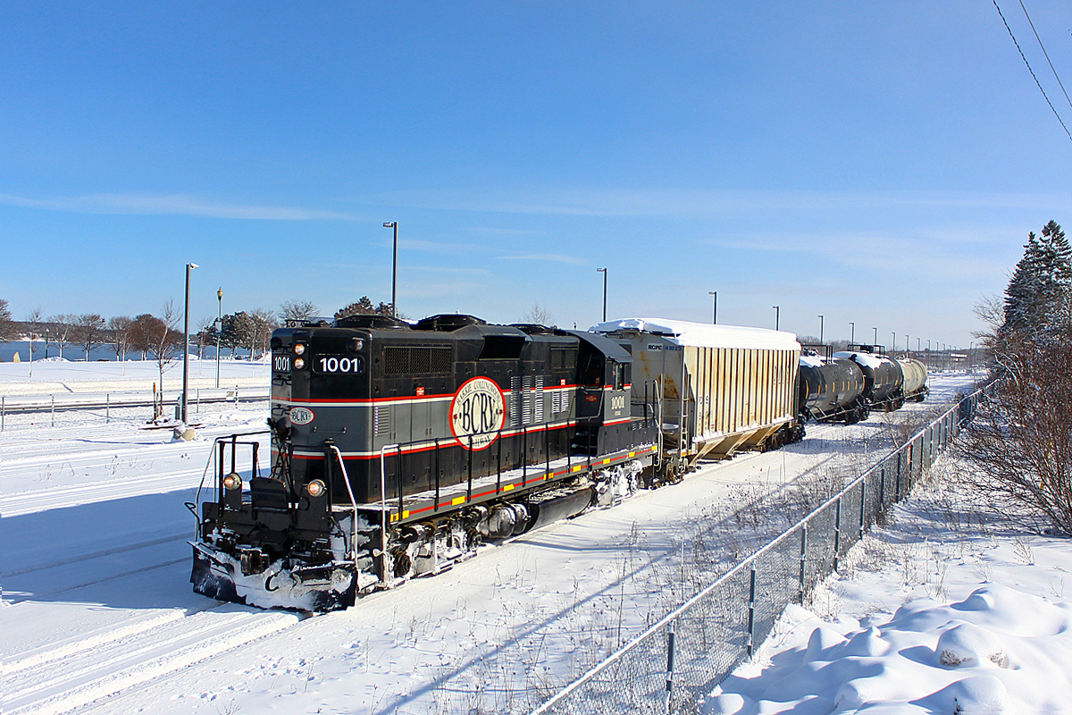 The regular Monday and Thursday run on the BCRY returns to Utopia to interchange with CP after switching Comet Chemicals in Innisfil. I had chosen my spot on top of a 10 ft snow bank for this shot, so this vantage point is very limited. Anyways, the BCRY is seen here passing GO's Allandale Yard. Out of the shot is a hi-rail backhoe with a snow blower attached to it, which was clearing up the yard after a morning snow storm. I had been chasing the BCRY all the morning, and I could tell by the conductor's expression that they were getting a little tired of me. Or maybe it was that I was on top of a snow bank. Or both.