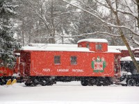 During a heavy snow fall, CN van 79078 looks piece full almost Christmas card like as it sits on display in Lindsay. Other equipment there includes another CN caboose, a few box cars, a CN GM-switcher and TH&B steam engine. The Lindsay train group have done a very nice job preserving this equipment. Worth the drive to have lunch in the park ( summer ) next to the display and admire the past. Taken from the Home Hardware parking lot.  