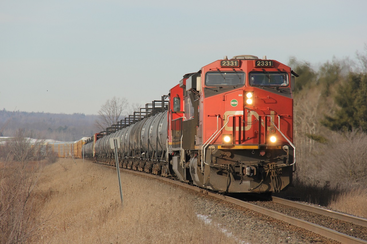 CN 2331 and CN 2032 lead a long CN 435 apparently (I wasn't sure until I saw BPurdy's photo on here). It is pictured approaching 5 Sideroad at CN Mansewood in Milton, ON.