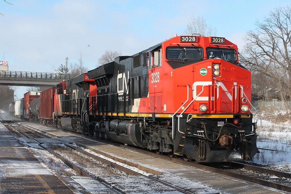 Two of CN's newer locos 3028 and 2938 power up the bank. The early snow had gone and the sun had arrived but it was still very cold!