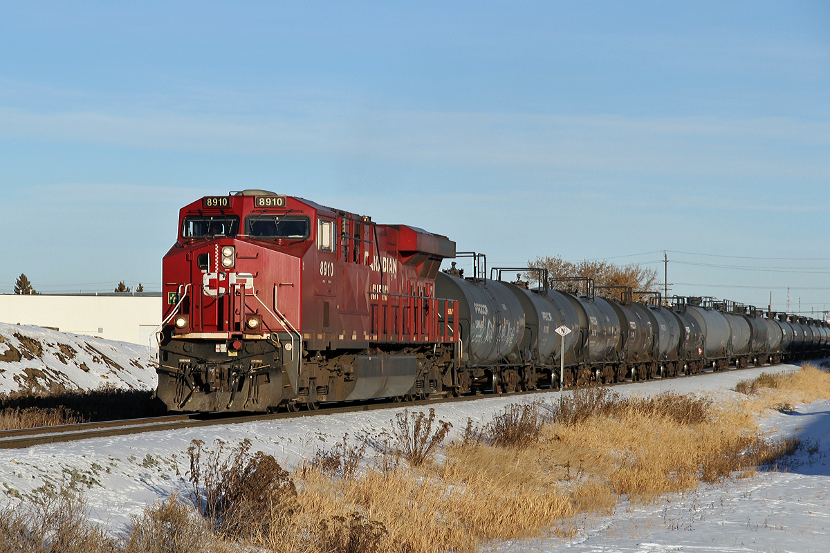 ES44AC CP 8910 is switching/building a train at CP's 50th Street yard in Edmonton.   Each time it pulls forward it closes 50th Street for several minutes.  Fortunately New Years Day the roads were quiet, pity anyone caught with this on a normal weekday rush-hour.