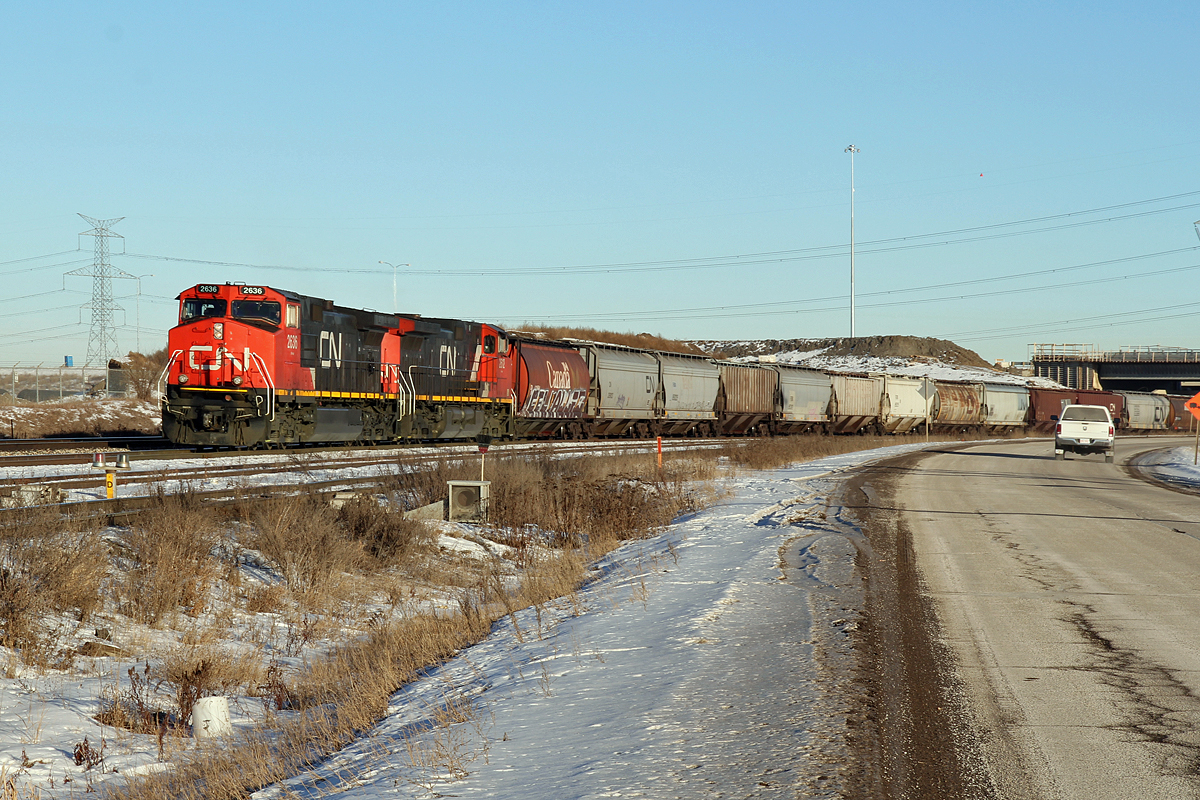 Held by the sgnals at the west end of CN's Clover Bar Yard Dash9-44CW's CN 2636 & 2612 wait for the road into Edmonton.
