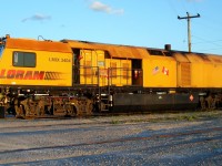 Loram rail grinding train locomotive,just know by the trucks that it's based on a GP series. Any information would be great.