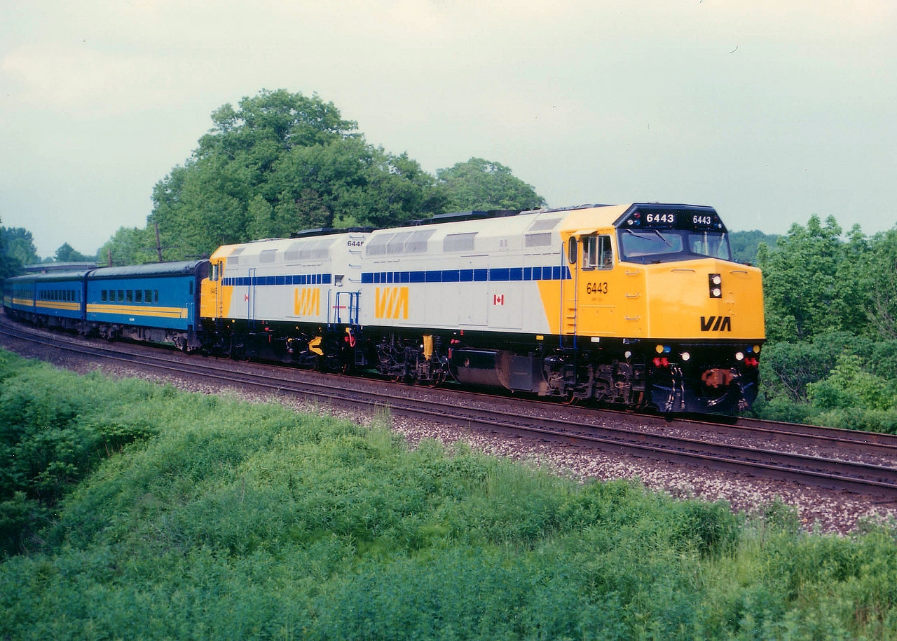 I am still having trouble coming to grips with the fact these F40s are now over 25 years old. To me, they are still the "new junk" that came along to knock off our beloved F units; so popular that hoards of American fans came to pay us a visit in order to spend a day shooting them before they were gone. Here, late train #75 spots two new units at the beginning of their life; VIA 6443 and 6445; plenty of power for this train. This replaced the A-B-B-A setups we were so in love with back then.  When this train came by; I wondered why they were not consecutive numbers........well, the next westbound, #77, had the 6444 as power.  The 6444 was wrecked in that horrible accident in Burlington in 2012, but these two units pictured soldier on.