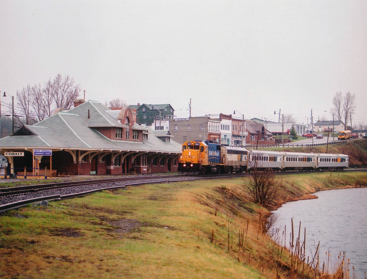 ONR 1801 with the 6 days per week passenger train coming up to the old Cobalt station. I liked this train because it was about the only thing thru here that kept a schedule. Alas, it no longer runs, having been sliced and diced and spit out by the Liberal government near the end of September 2012. Just another nail in the coffin of the North. The government doesn't care, after all, the North does not compound to very many votes. And that is the name of the game.  The station? It currently is a museum, if I remember correctly. Cobalt is steeped in mining history, the still thriving town is well worth a visit.