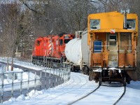 Heading north on the former Guelph and Goderich railway, the conductor on CP's Goderich wayfreight keeps a close eye on his cars from the van as the train trundles along between the Speed River and a trailway.<br><br>... obviously this is the OSR and it's 2016 ;) OSR's 434462 made a surprise appearance today after a multi year absence.. yet to be seen if this is a regular occurrence or a one-time thing. But the engines up front can nearly fool your eye to the true operator of this train... certainly reminded me of the trains of my childhood.<br>This photo inspired by Steve Young's recent <a href=http://www.railpictures.ca/?attachment_id=22404 target=_blank>Posting of the once common Van</a> now mostly a discontinued practice. I know of two railways around here that use a caboose regularly, CSX in Sarnia (who have two and use nearly Daily!), and I guess OSR. Any others use one regularly? Comment below if you do! thank you.