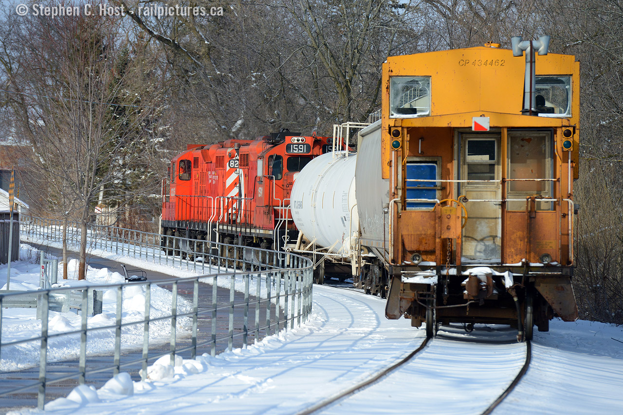 Heading north on the former Guelph and Goderich railway, the conductor on CP's Goderich wayfreight keeps a close eye on his cars from the van as the train trundles along between the Speed River and a trailway.

... obviously this is the OSR and it's 2016 ;) OSR's 434462 made a surprise appearance today after a multi year absence.. yet to be seen if this is a regular occurrence or a one-time thing. But the engines up front can nearly fool your eye to the true operator of this train... certainly reminded me of the trains of my childhood.
This photo inspired by Steve Young's recent Posting of the once common Van now mostly a discontinued practice. I know of two railways around here that use a caboose regularly, CSX in Sarnia (who have two and use nearly Daily!), and I guess OSR. Any others use one regularly? Comment below if you do! thank you.
