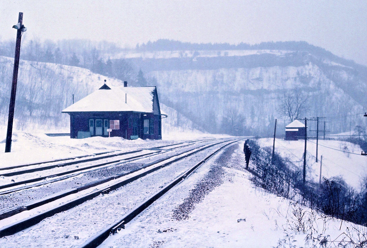 This, oddly enough, is one of my favourite photos. And there is no sign of a train. That exactly is what I like so much about it. Besides the obvious, there is something in this photo that is missing in today's world. Tranquility. This is on a Sunday morning. This is back 40 years ago when once upon a time there was no Sunday business; no reason to get out of bed early. (Except for us crazies, of course) What little noise there was from the town below was muted by the softly falling snow. For many of us, getting trackside means getting away from life's everyday hassles. And for me, sharing the early morning serenity with old Dundas station, well, it didn't get much better than this.