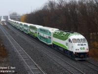 <b>Do you like me?</b> is what I imagine this engine would say in this photo. GO 647 is shown with a 14 car (!) GO train at Burlington Station, with the heavily modified GO 647 in the lead. First built in 2010 as a MP40PH-3C, 647 was sent back in 2013 to MPI for conversion to tier 4, which MPI calls the MP54AC. But it's probably not the same as a true MP54AC and is likely to be a one-off.<br><br>What was done? The EMD 710 engine was removed (Oh the horror!) two Cummins QSK60 engines have been installed (Total 5400 HP) the body heavily modified to allow for the extra exhaust stacks and air intake grilles, control systems modified.. a true MP54AC would also change the traction motors to AC but I have been informed this wasn't changed in this unit, which means this may be the only DC powered MP54 - would this be A MP54DC in this case? Either way, there are 17 or so more of these coming, but all will be built from the ground up instead of re-powered like the 647. It's yet to be seen if GO Transit will elect to bother with AC traction in the new models or continue with DC, surely like any locomotive these will simply be 'options'. <br><br>This train was a GO break-in and testing run for 647, over this weekend they ran with the 14 car train set (2 extra cars to simulate a fully loaded train) at speeds up to 90-MPH, to assess braking, stopping distance, acceleration and station to station performance. The train also uncoupled half the train to test under lighter loading conditions or with shorter trains. Metrolinx would then surely decide if they indeed liked 647.. or not.. only time will tell what their decision is!<br><br><b>What did it sound like?</b>.. to put it mildly... a truck. Quite underwhelming, but not unexpected.  <br><br>So.. do you like this engine? What do you think? Comment below. P.S: This engine is likely to enter service this month if not already.