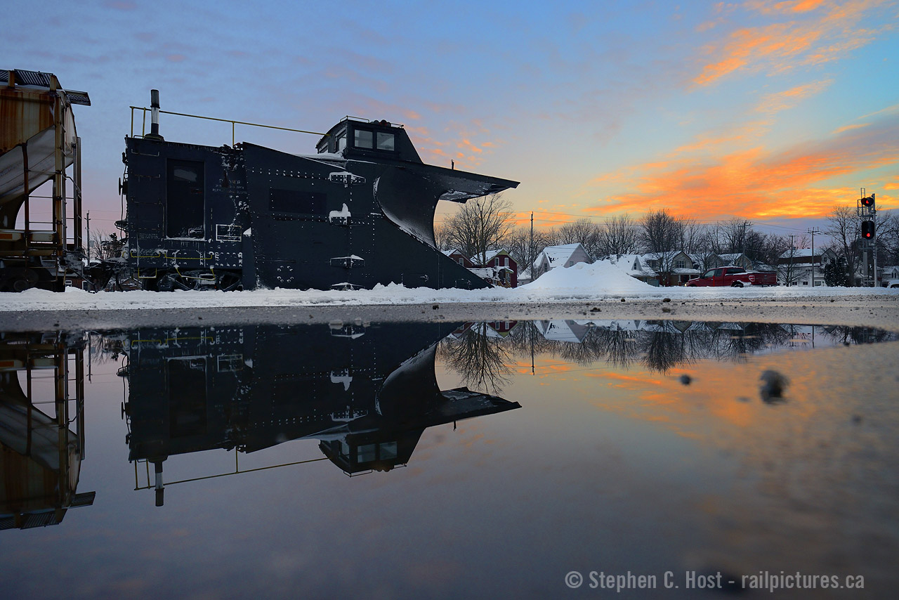 At the end of a day's chase one often reflects on the moments and photographs collected. I spent the day along Highway 8 between Stratford and Goderich chasing a plow west, and a train east. What was the best moment and did you pull off 'that photo'? 581 has reached their home terminal at Stratford, the sunset is indicating a Sailors delight and I capture a reflection of Plow 55413 in a small pond - to cap off a great day.