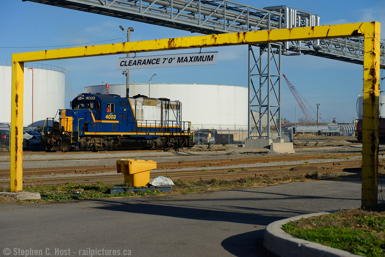 I was hoping to shoot this job coming out with some cars.. but a broken rail changed all plans and the crew are returning to the yard light power, not taking the risk of running cars across a broken rail. Shown is the train leaving the Bunge yard area in the North end of Hamilton along Burlington St.