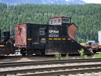 PLOW 400640 AWAITING THEBIG SNOW DUMP IN THE WINTER SEASON. JORDAN SPREADER 402897 COUPLED BEHIND SITTING DORMANT.