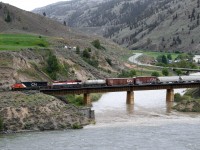 Eastbound CN mixed freight 416 using directional running on the CP crosses the Nicola River just east of Spences Bridge siding in the Thompson Valley.