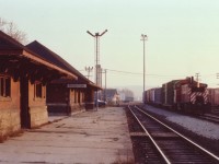 CP 8142, an SW1200RS, (now all off the CP roster) slows to a stop at the old Woodstock CP station. I do forget whether he was just getting papers to leave or whether he had come in for the day. I do recall it being warm for this late in the year; a nice end to the day was this "mood shot" before I headed back home. One can almost feel the peacefulness of the scene.  The MoW building on the left has long since been demolished, and the mainline has been shifted well away from the station. Woodstock CP station still stands, an all-purpose building; including usage as an office for the OSR when they come into town to switch with the CP.  CP 8142, built way back in 1959, now toils for the Black River & Western in New Jersey.