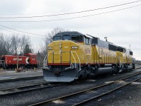 A pair of  UP SD60M,s just delivered from GMD, sit on number 2 shop track at Quebec street in London awaiting there westward connection to Chicago. The yard job is heading to the old circus loading dock to retrieve  a flatcar. Quebec street yard is much like the rest of CP disappearing from the landscape. Every thing in this view is history including the roundhouse, stores department and engine servicing facilities.( not pictured here )   