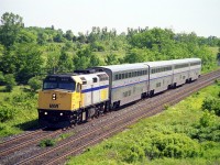 The Via/Amtrak International Wb passing threw Hyde Park. With Via 6419 and four super-liner cars. Headed for Sarnia, Port Huron and onto Chicago. Amtrak F40,s and Pepsi can GE,s where also used for power with the super-liner cars. Would have liked to have seen an LRC and super-liner consist. The CP Windsor maim can be seen just above the train. 