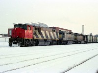 The winter of 1983-84, BBD test unit 7004 teams up with leased QNS&L SD40,s WB at CP Quebec Street, London. Can any body help with train number and a better date for this photo. All info has been erased with time on my sheets for this picture. The air tanks on the QNS&L units have been moved into the rear of the car body by the air compressor. Larger fuel capacity because of the remoteness of the Quebec North shore and the air tanks being located inside the car body had less chance of an air freeze up in the extreme temperatures in Quebec during winter. 