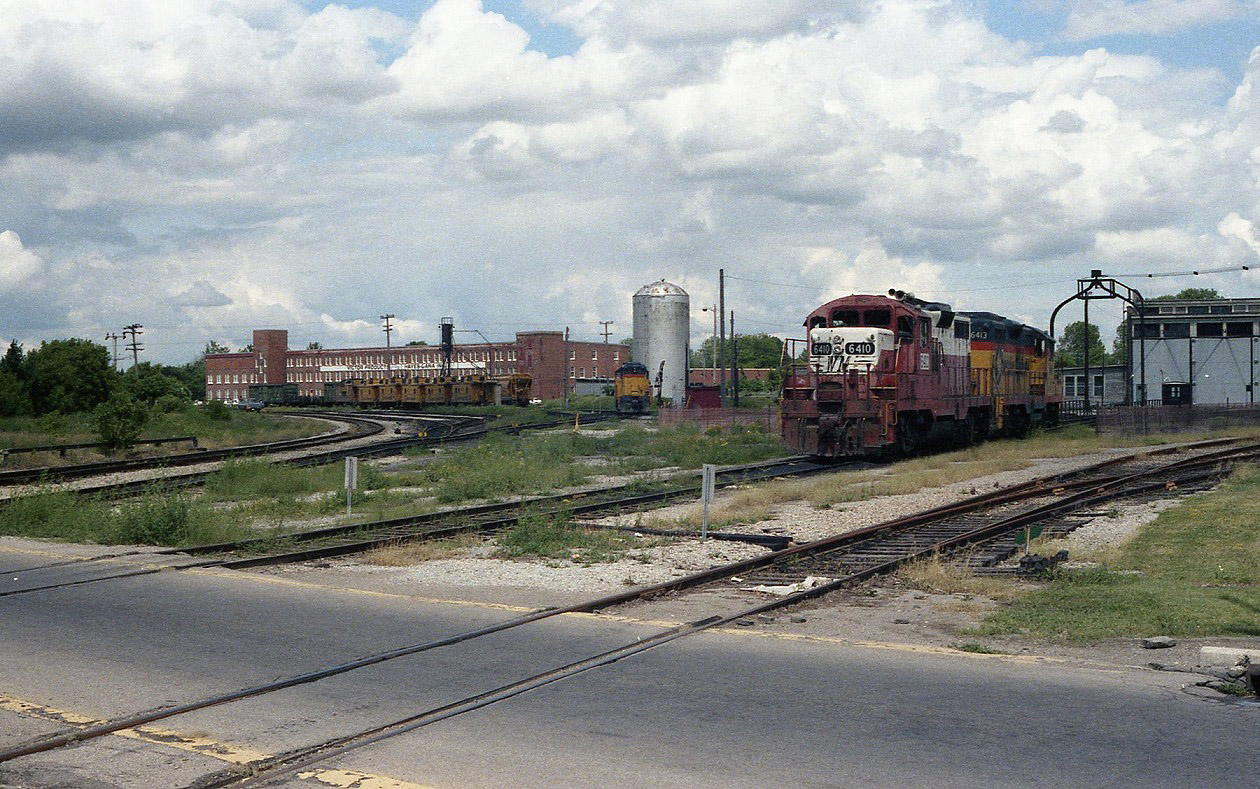 An overall view of Chessie,s engine facilities in St Thomas before every thing was demolished. The yard office is directly behind me and the actual yard ( Buffalo yard ) to the west across the hi level bridge. Named Buffalo yard because there was a farm with buffalo next to the yard. Three homely looking units in one spot. GP38,s soon replaced these wore out engines.