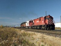 Extra 502 begins to accelerate after the crew change east of Markham road. A steam tradition carried over, white flags and class lights symbolize an extra. The last unit, a bandit SOO 6312 ex Milwaukee road SD40-2. These units showed up in Canada  for only a few months before being sold off or returned to the leasing companies .