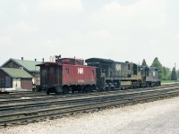 N&W 2705 8067 and caboose 557780 are tied up at CN,s ST Thomas facilities awaiting the next assignment. Yes the geep did lead. The classic motor car shanty and tool house was still in use along with motor cars in 1980. 