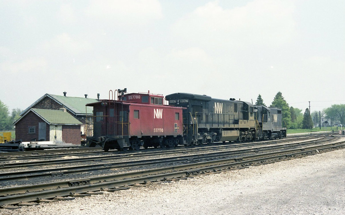 N&W 2705 8067 and caboose 557780 are tied up at CN,s ST Thomas facilities awaiting the next assignment. Yes the geep did lead. The classic motor car shanty and tool house was still in use along with motor cars in 1980.