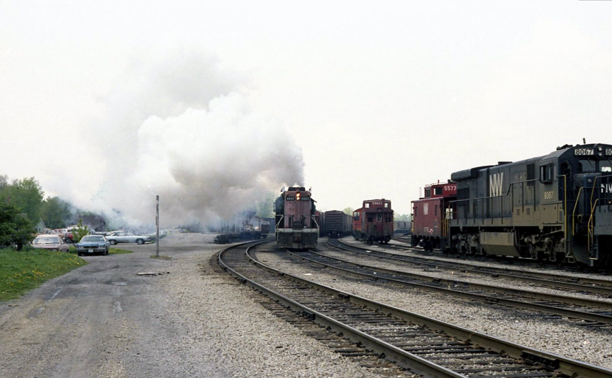 CN 4507 pushes its train of auto parts and gondolas of scrap metal west threw the yard out toward the Ford plant at Talbotville. To the south of the yard office, not visible threw the exhaust is houses and the women who had just hung her laundry out to dry was furious.
