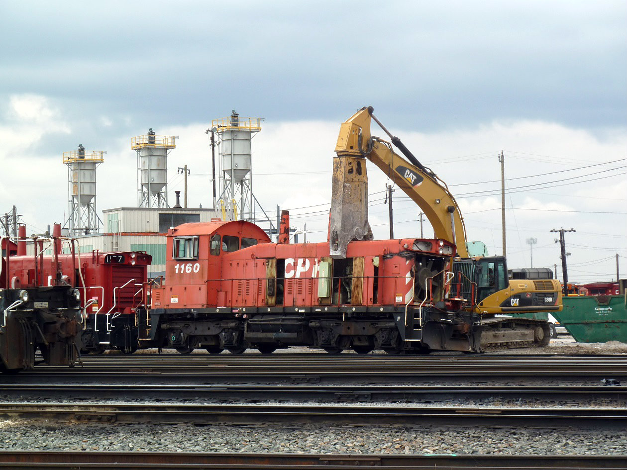 Built in London in 1960 as SW1200RS 8171 and converted to a remote control cab . CP 1160s fate is at hand. A site no railroader should ever witness , having worked on these units for many years. The location is track 1 at the Toronto diesel shop. Because of safety concerns the scraping of this unit and many others was moved to an isolated track away from where employees where working. 8171 spent most of it time switching around the SOO and other northern Ontario yards.