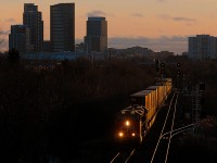 With 12,285 ft for the Port Of Montreal on the drawbar, this pair of ES44AC's have no problems with this train well in hand as they pound the diamond at Doncaster.