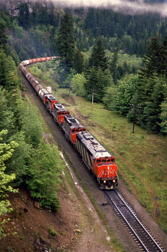 An eastbound grain and potash train is approaching Alexandra Bridge Provincial Park in the Fraser River valley between Hopw and Boston Bar. It was pretty obvious at the time that there was a preference to have the cowled units lead the trains.