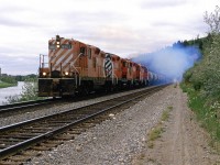 The "Exshaw Turn" would run the same power set for a few days, before it would be changed out. I suspected that the high-nose Geep would be leading and that it would also have a smoker. Unfortunately, I could not get a sunny day.
Here it is alongside the Brickburn siding.