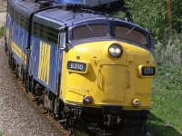A little oil is being consumed in the engine as the locomotives throttle up after passing over the east switch of Brickburn.