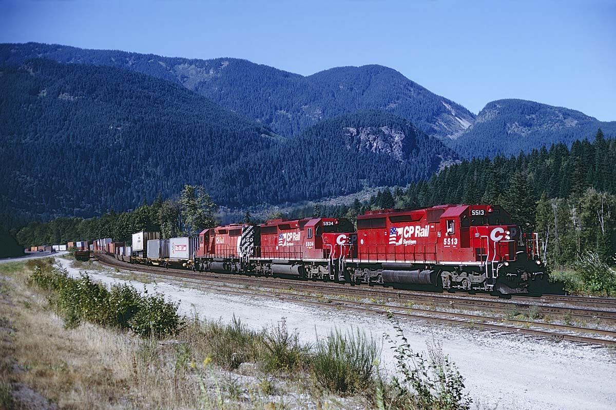 3 SD40's leading an westbound intermodal west of Yale, BC.  There was a time when 3 SD's was so commonplace that it was disappointing. However by the 90's we were happy to not see a wide cab on this one.