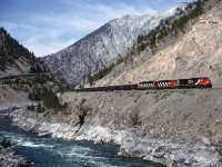 A just over a year old C44-9W leading 2 EMD's and an empty hopper train through the Thompson River valley a few miles east of Lytton