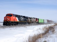 CN 2885 with BNSF 4712 west bound at Waterworks Sideroad on a sunny but very cold February day almost one year ago.