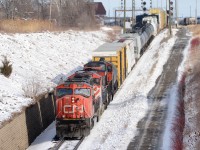 Train 385 heads west towards the St. Clair River Tunnel to Port Huron, MI., with CN 5687, BCOL 4643 and CN 5633.